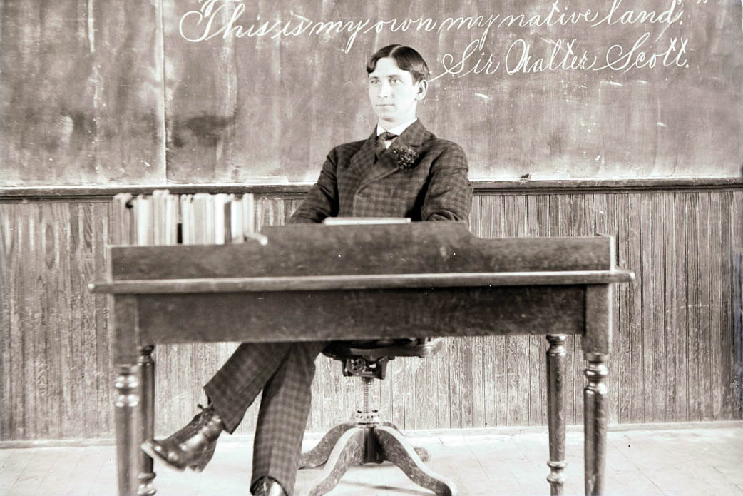 black and white photo of an old school teacher